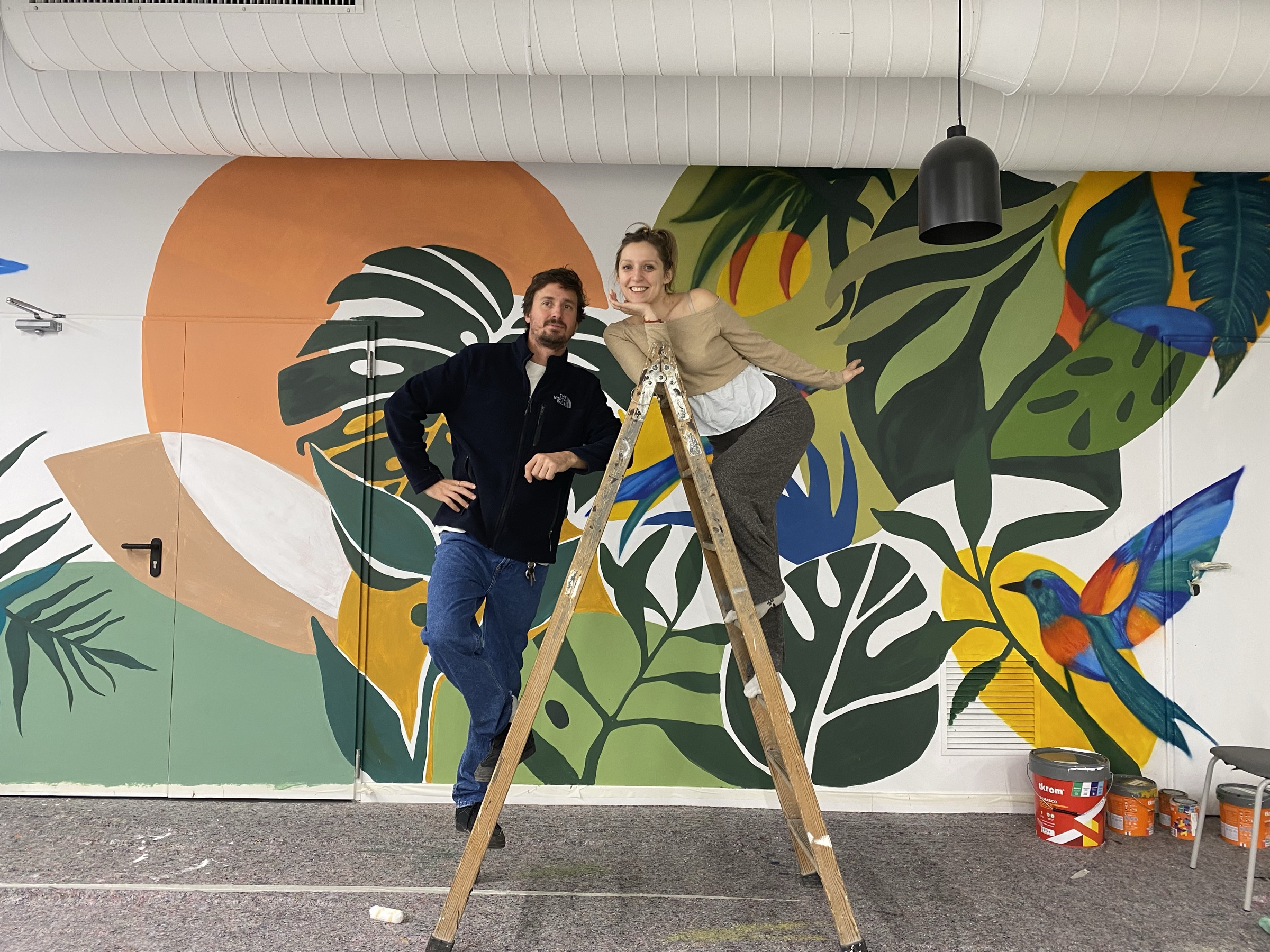 Matt and Tea working together on a mural