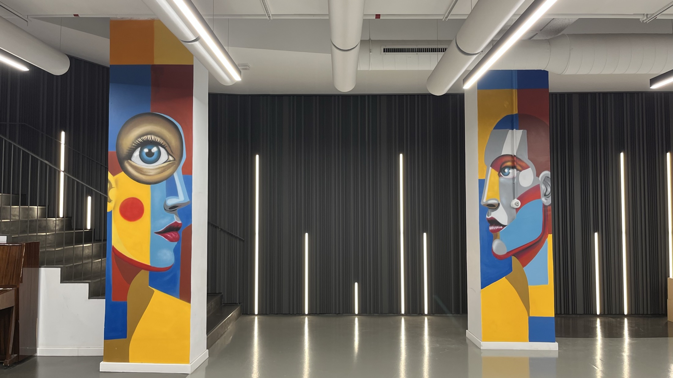 Wide mural spanning a school corridor wall
